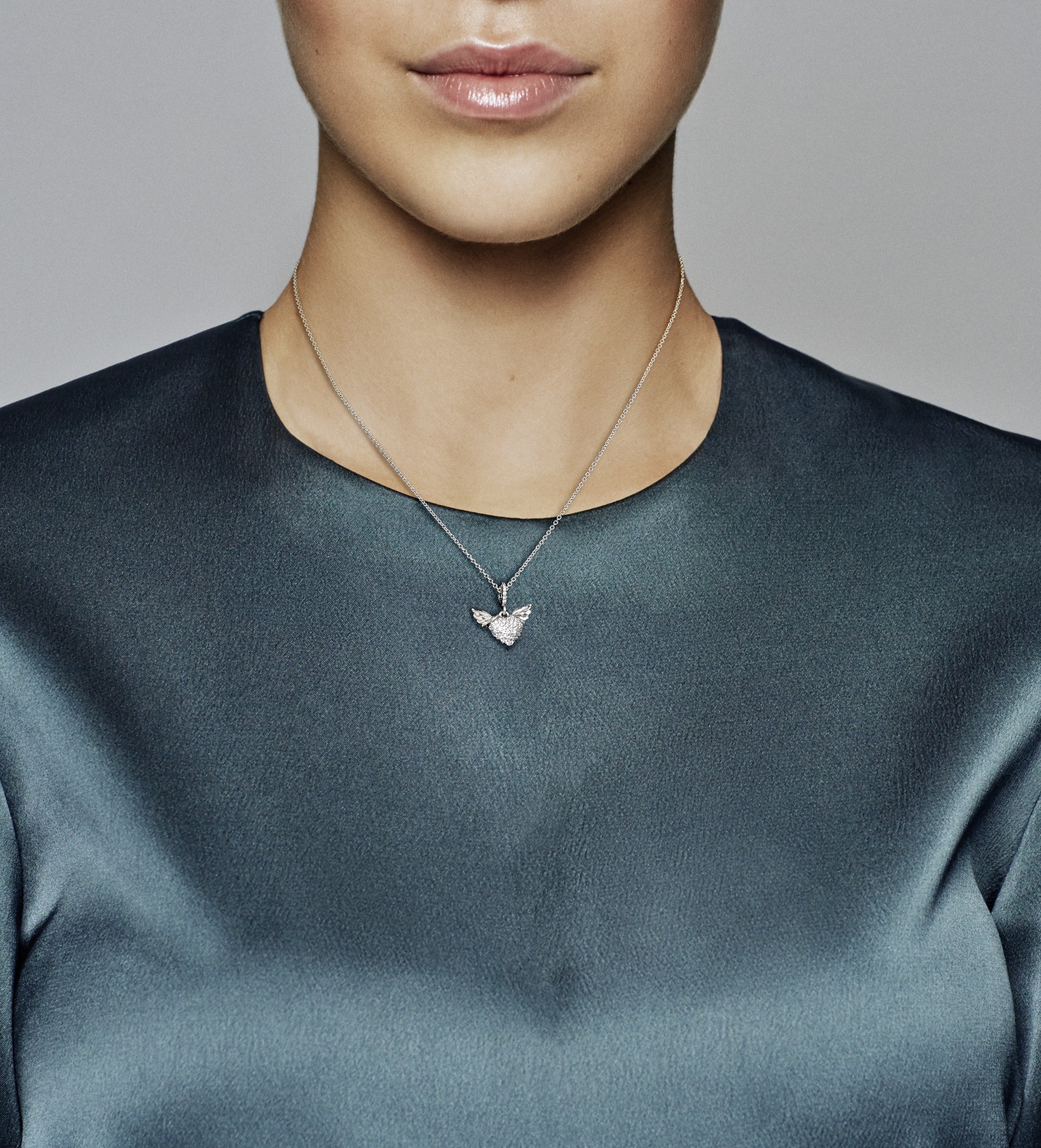 Heart and wings sterling silver pendant with clear cubic zirconia and necklace